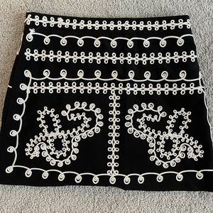 Black mini skirt with really cool embroidered off white stitching